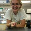 Smith grins over a tethered blue crab.