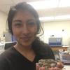 Lopez shows off a sample of biological soil crust.