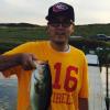 John holding a caught fish