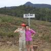 kika and erin standing next to wog rd. sign