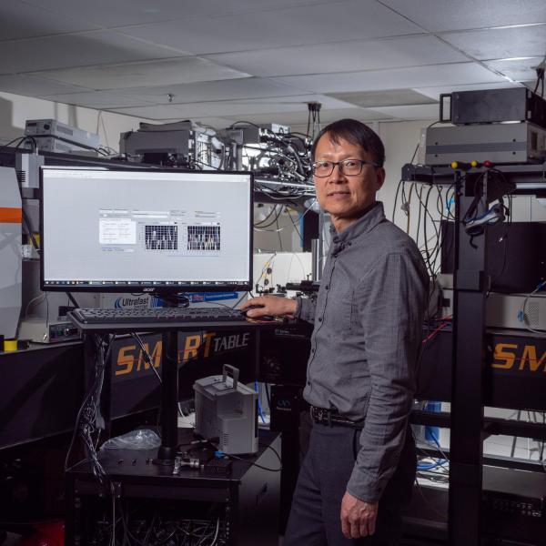 Won Park at a computer terminal in his lab
