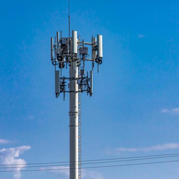 A cell tower against a blue sky