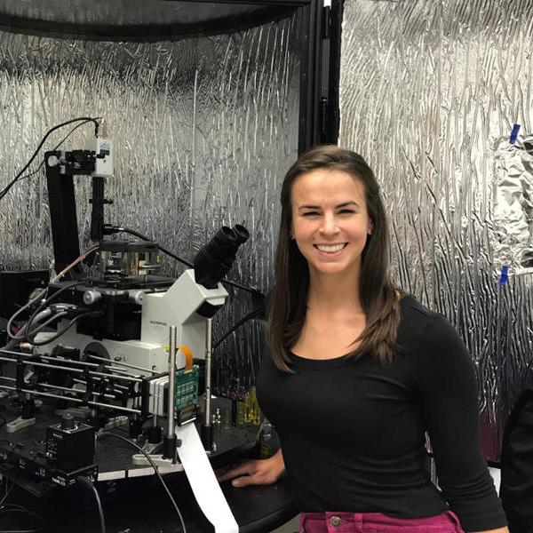 Callie Higgins with her hybrid atomic force microscope 3D printer.