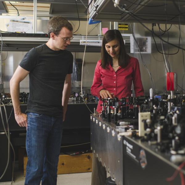 Gopinath discusses a project with a student in her lab