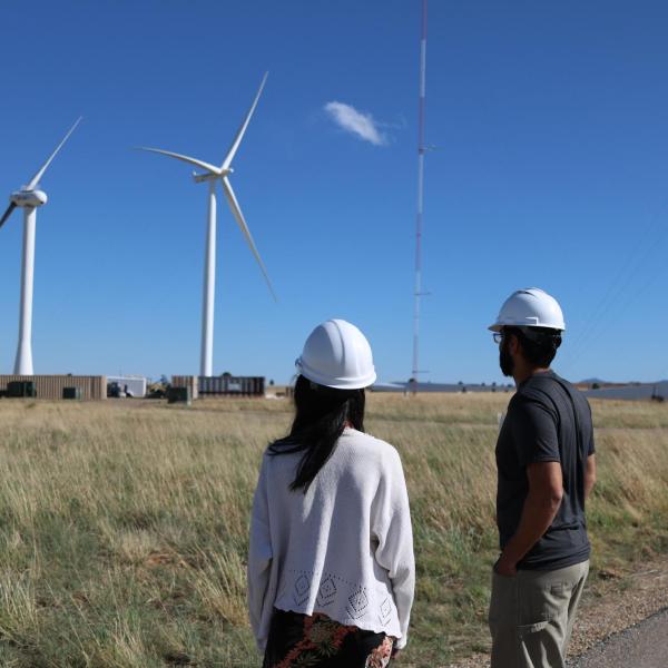 Pao (left) and her team members look at test turbines at NREL