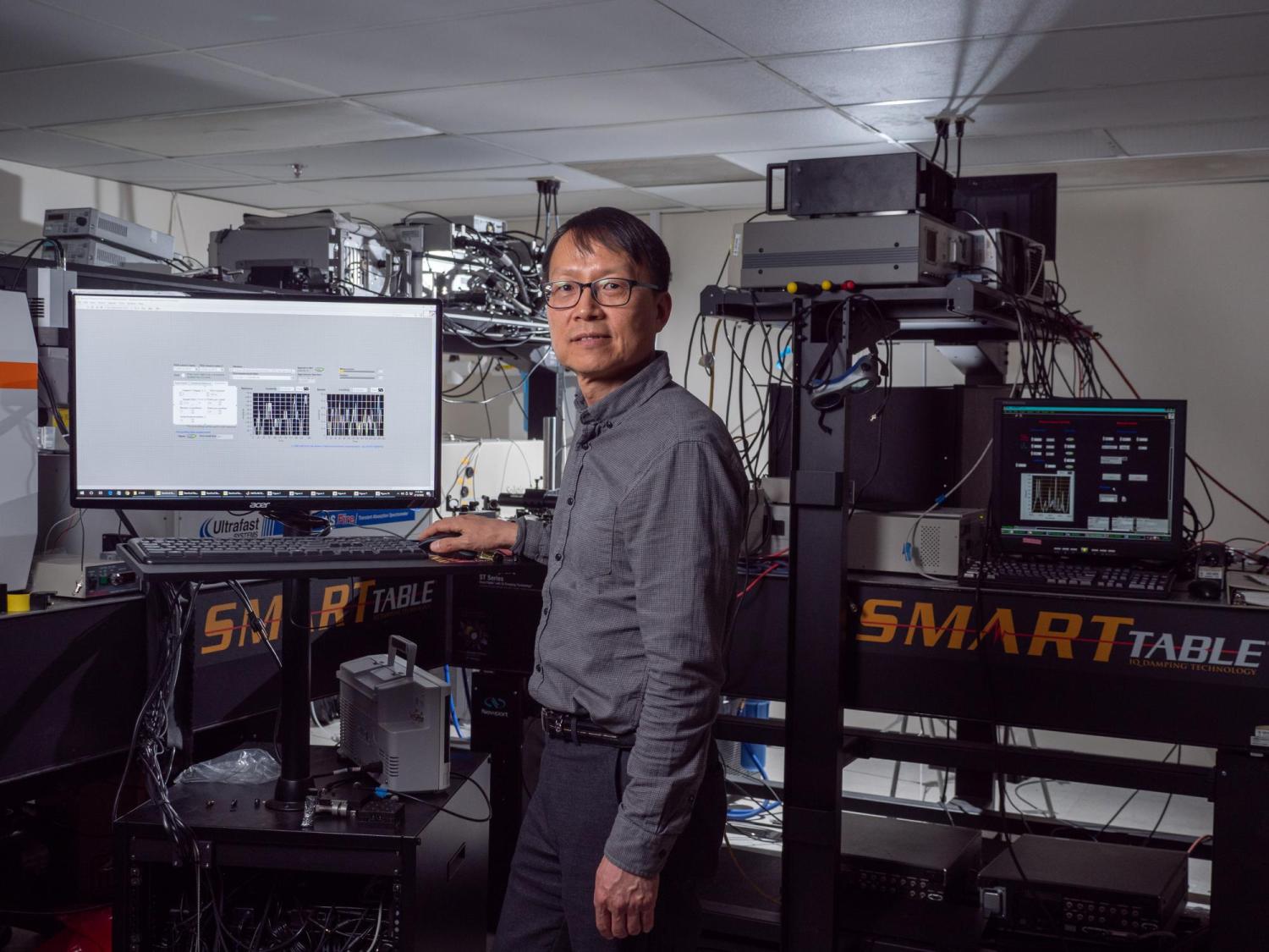 Won Park at a computer terminal in his lab