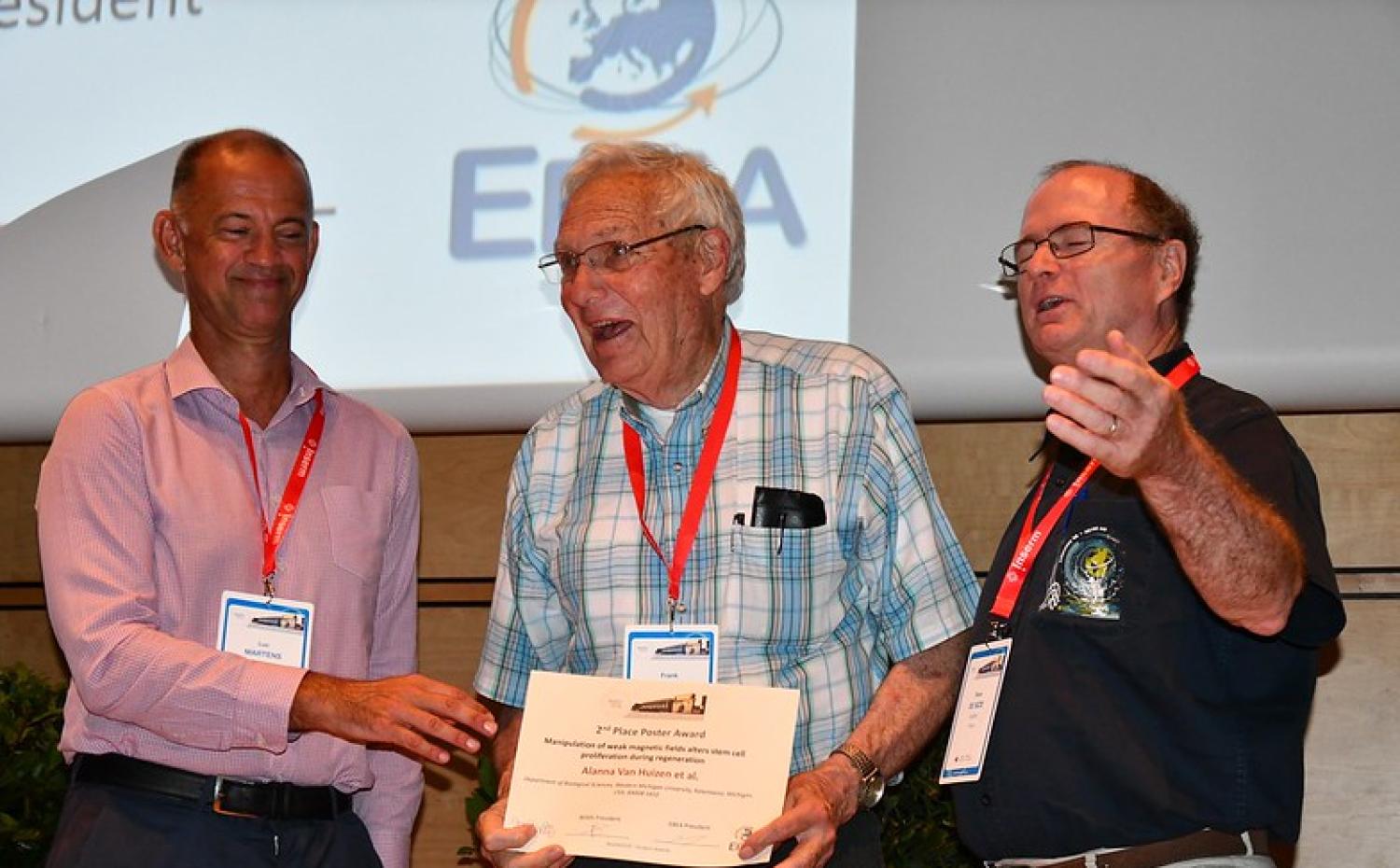 Barnes receives an award on stage at BIOEM 2019
