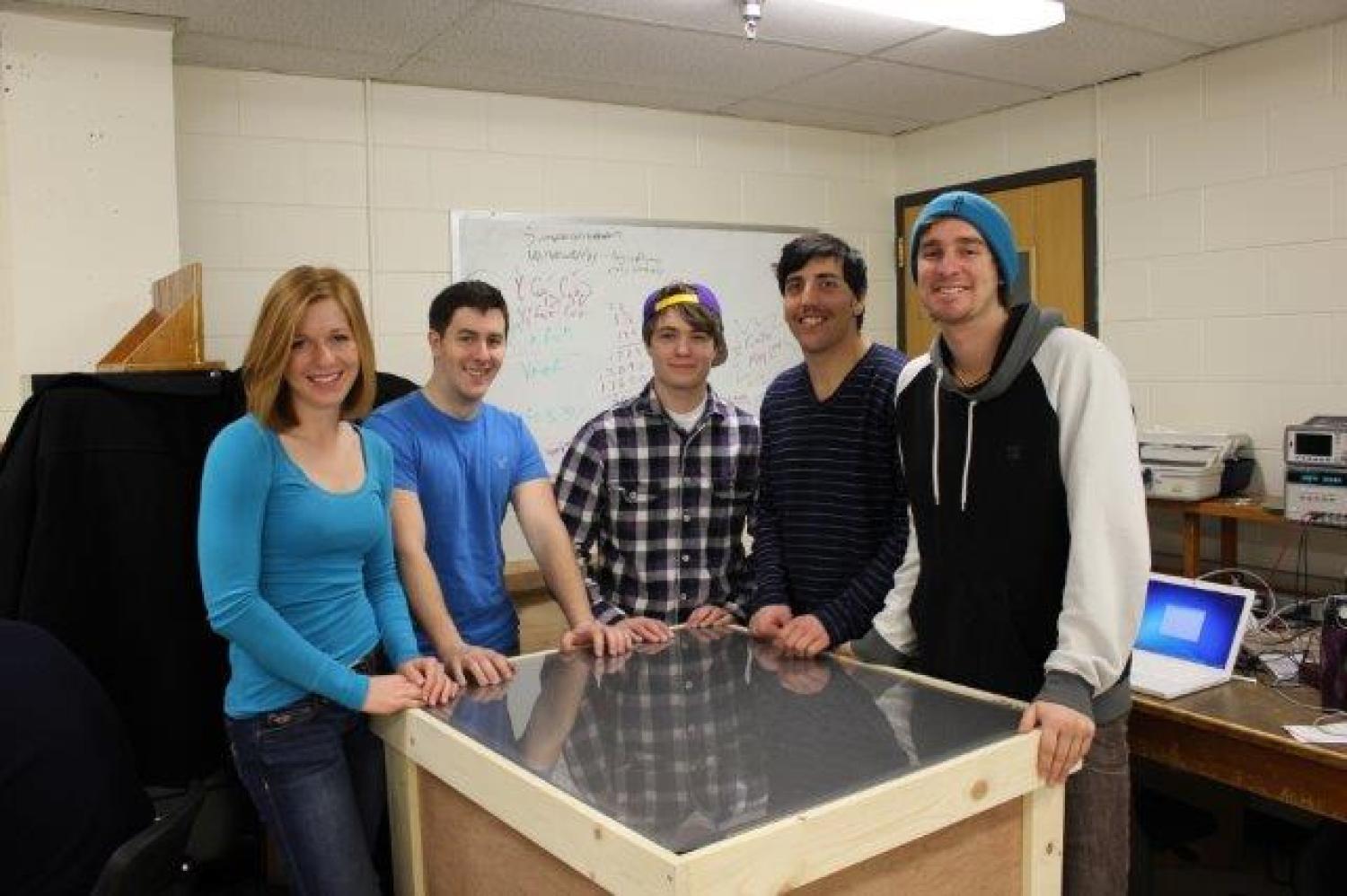 The five members of the COMIT team with their optics-based multi-touch table