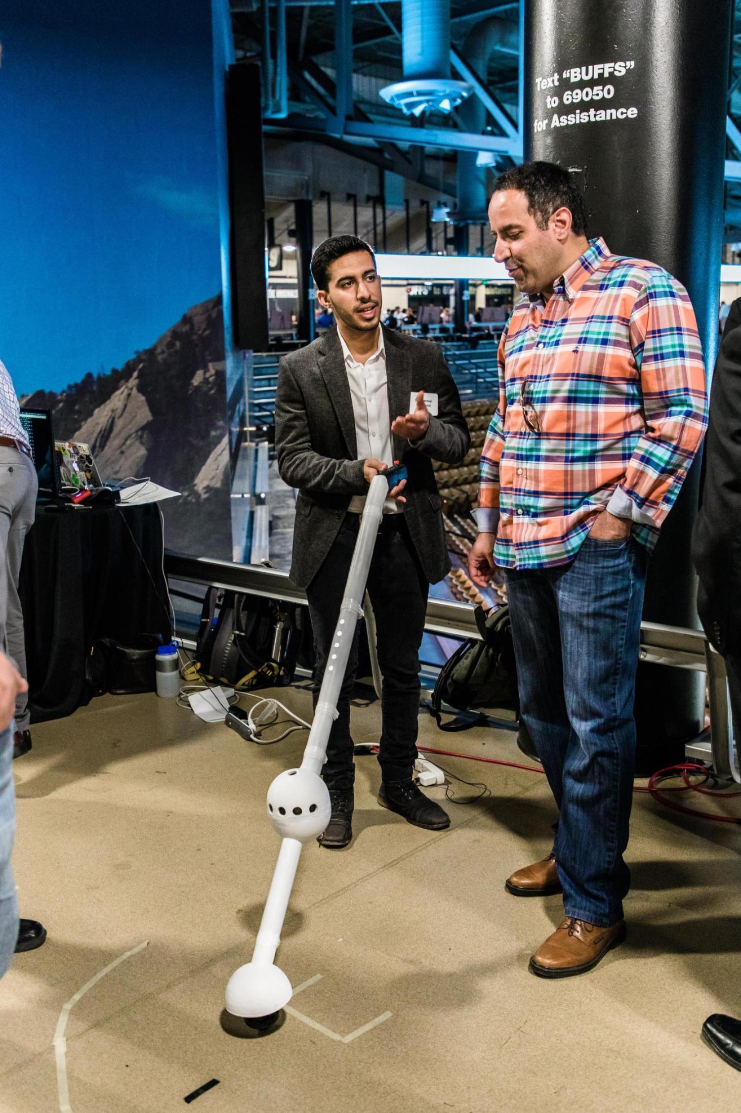 A team member demonstrates their prototype during the engineering expo.