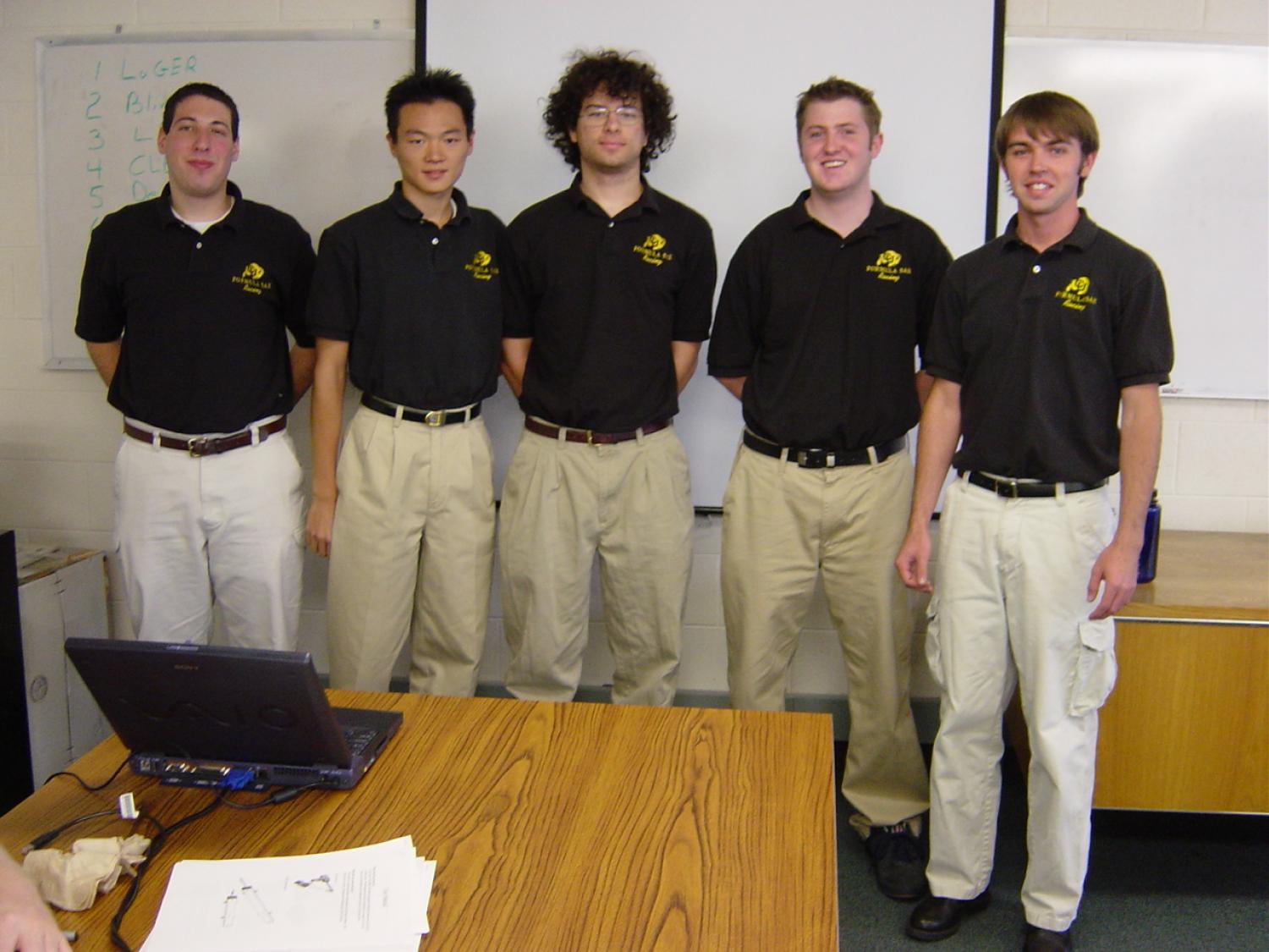 The five members of Darsi, in matching polo shirts.