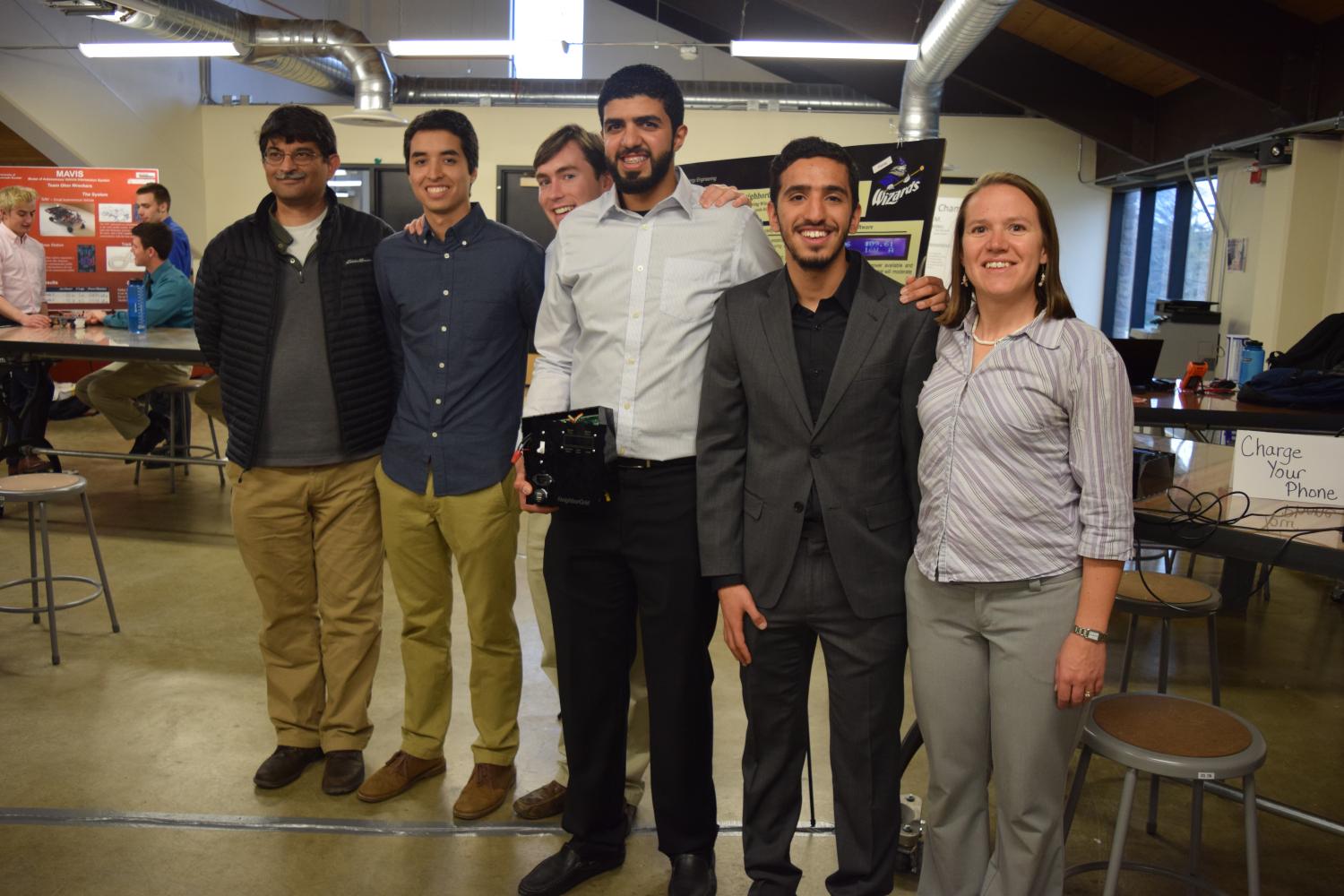 The members of Flying Wizards pose with their advisor, Khurram Afridi, at the 2016 capstone expo.