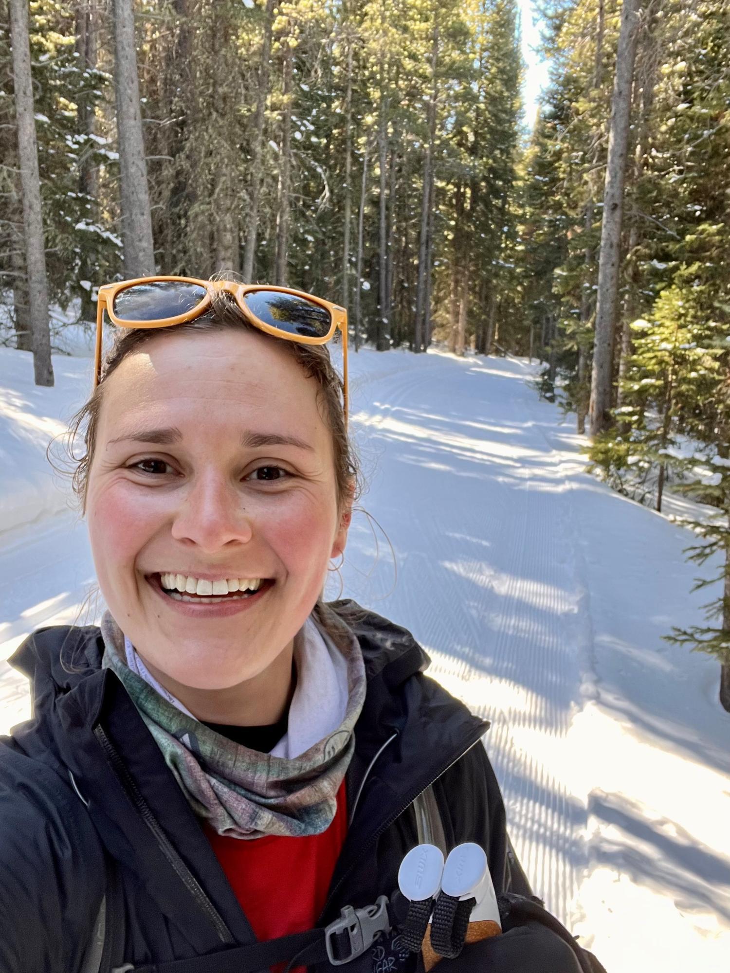 Anne on a snowy, wooded trail
