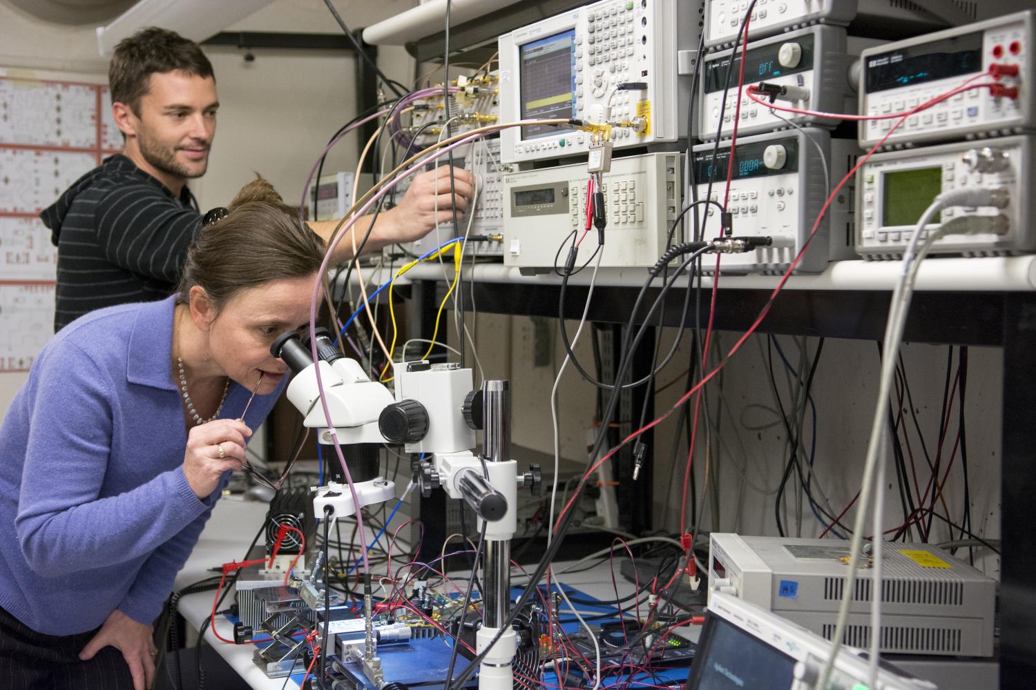 Zoya Popovic looking in microscope