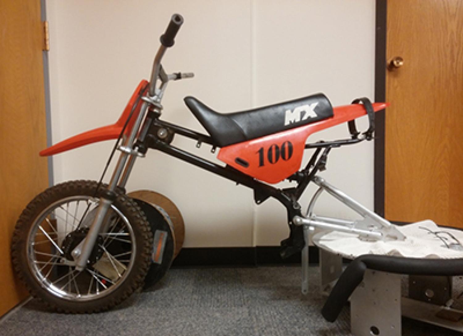 A gas-powered dirt bike that has been modified into an electric-powered bike