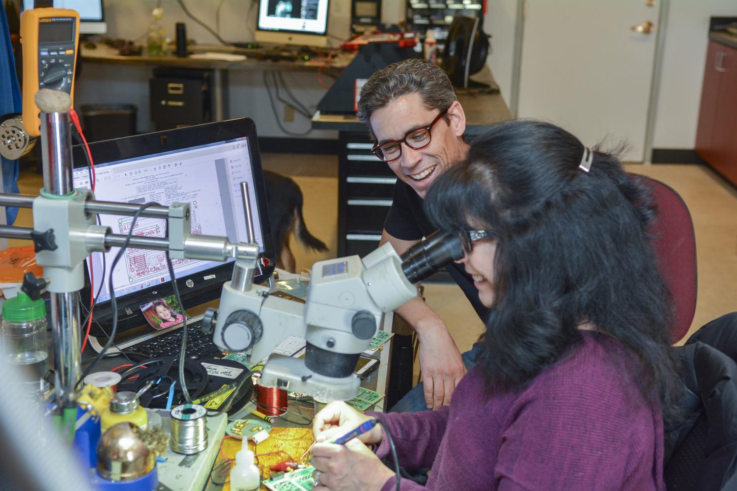 Breitbarth and technician in workroom