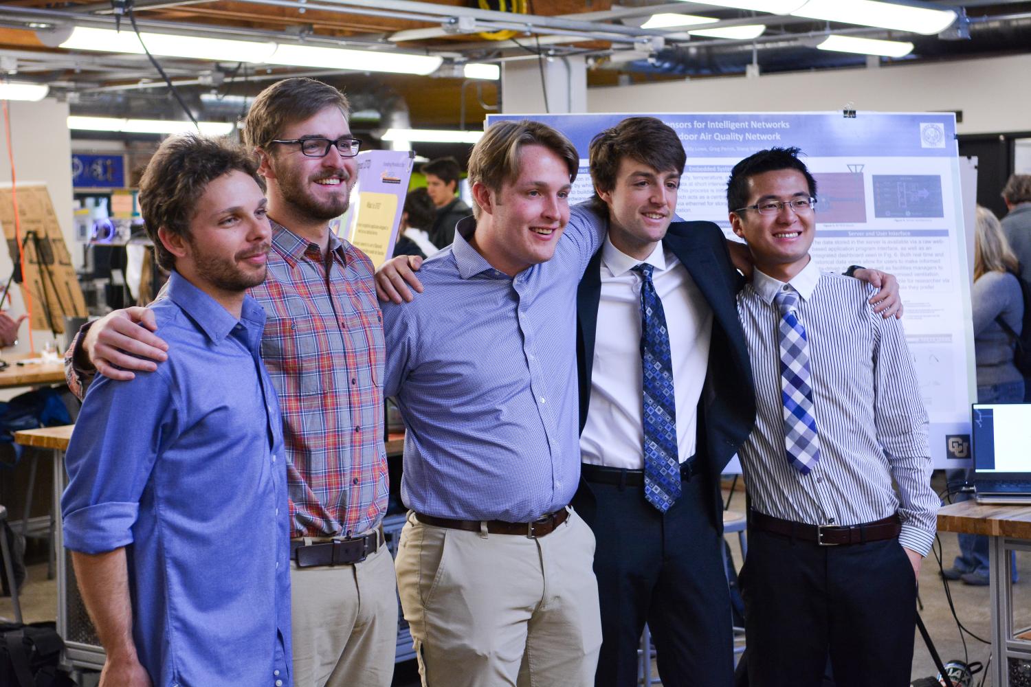 The five members of Sensors for Intelligent Networks at the capstone expo.