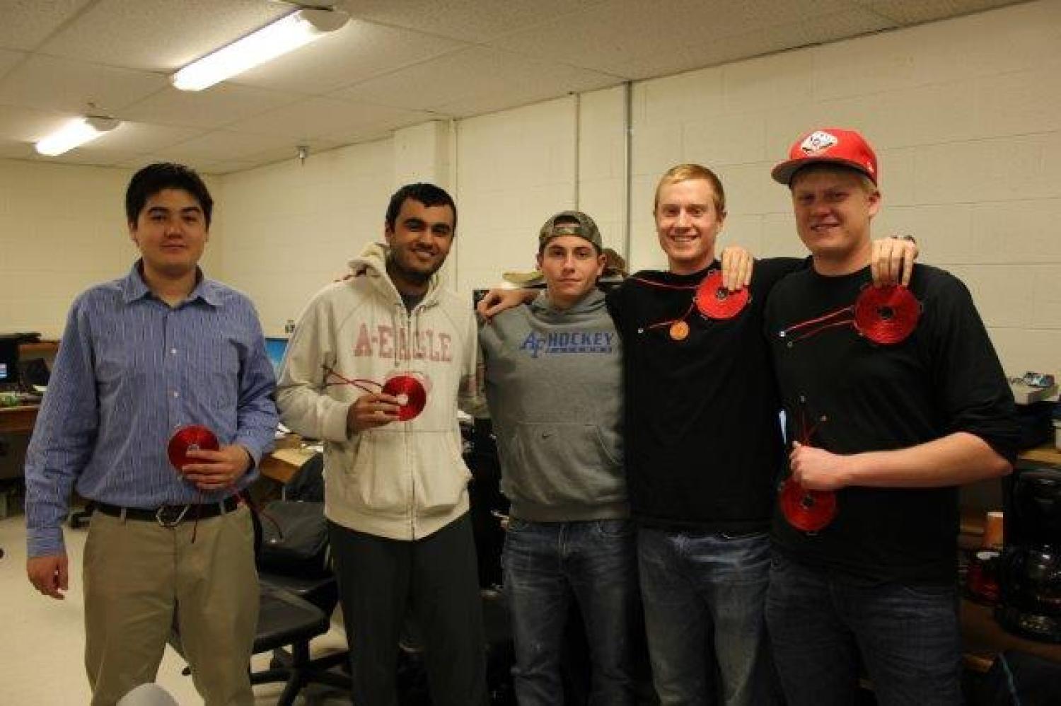 The five members of Iron Chefs hold their induction coils