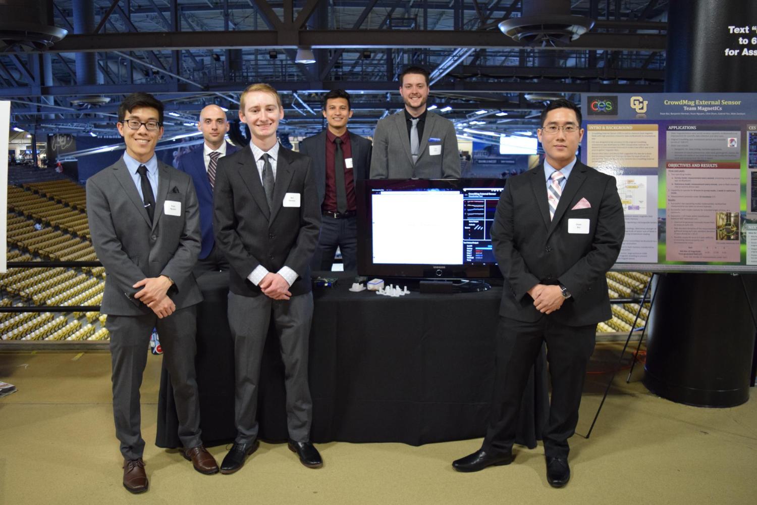 The team with their display at the 2018 engineering expo