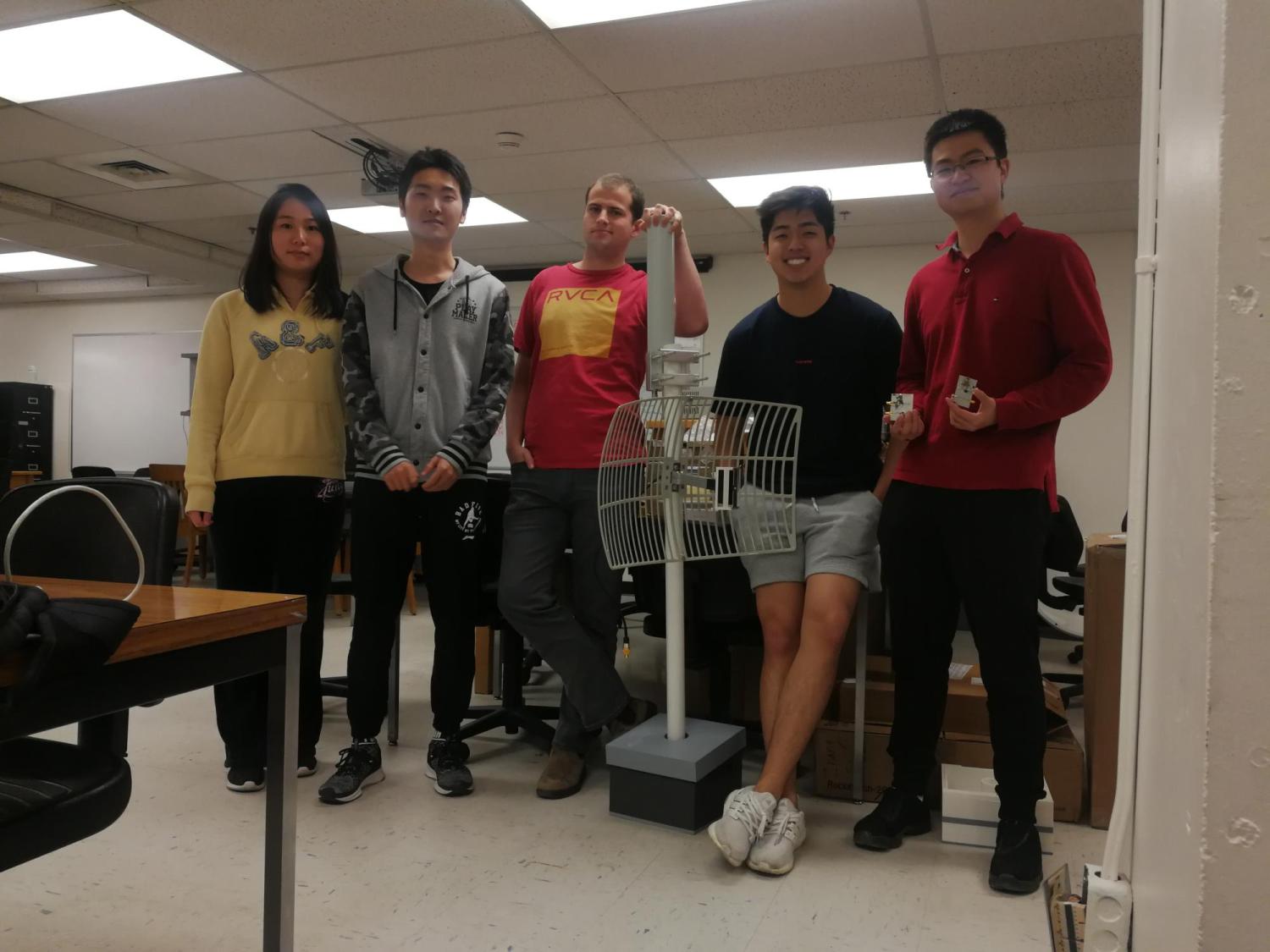 The team with their prototype in the capstone lab.