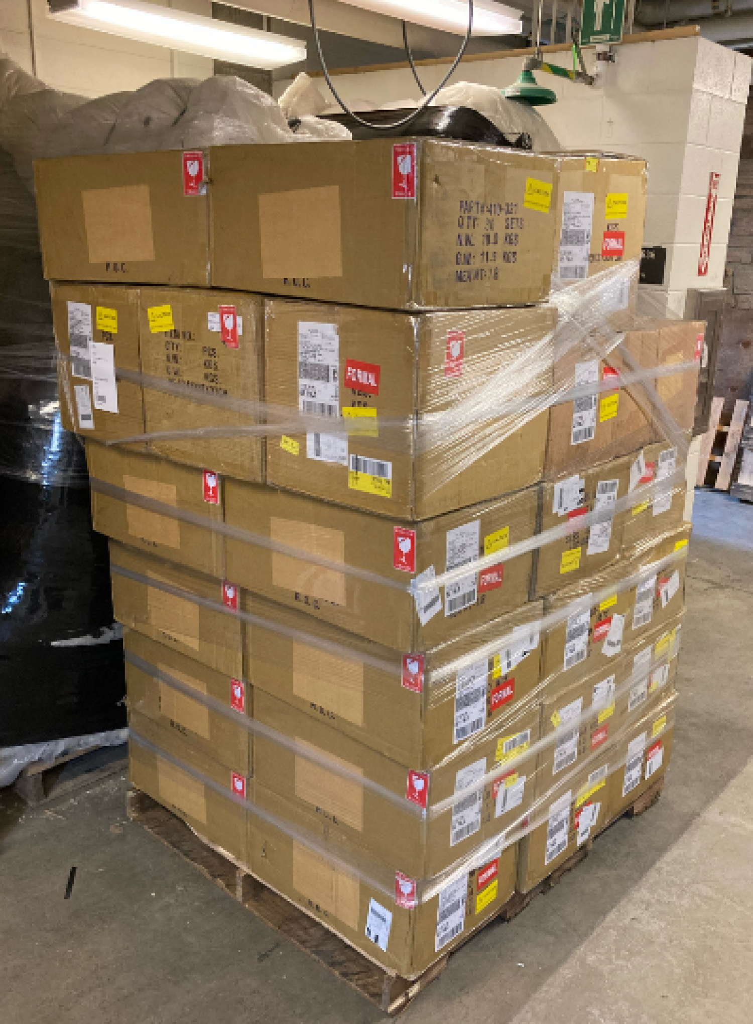 A pallet full of Analog Discovery 2 devices sits on a loading dock at the Engineering Center.
