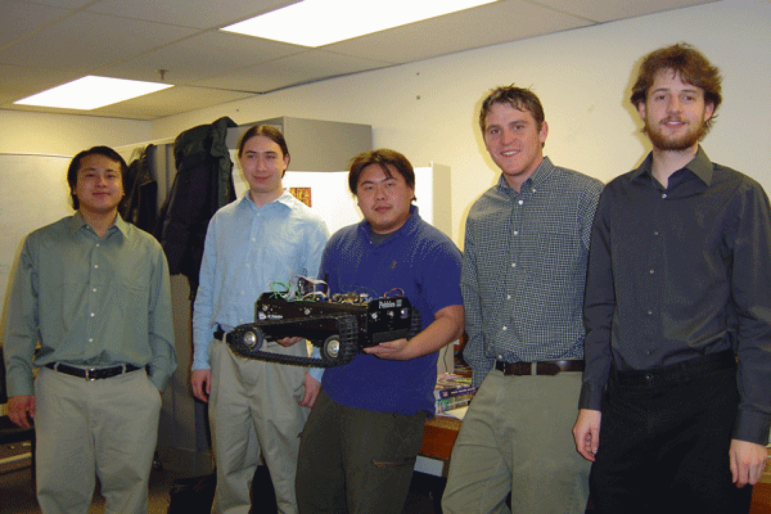 The five members of Tank pose with their prototype during the expo.