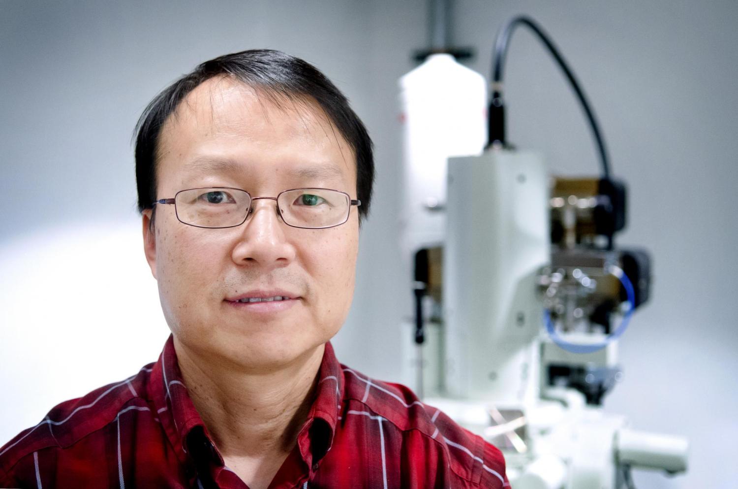 Won Park, with lab equipment in the background.