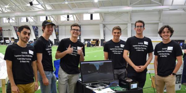 The team in matching capstone T-shirts at the Engineering Projects Expo
