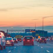 Vehicles on a highway at twilight