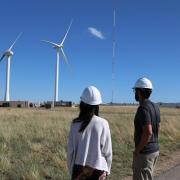 Pao (left) and her team members look at test turbines at NREL 