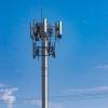 A cell tower against a blue sky