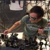 Brendan Heffernan adjusts optical components at a light table in the team's lab.