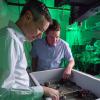 Scott Diddams and Greg Rieker discuss a project in the lab