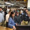 A student demonstrates her team's project at the design expo. 