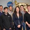 The team with professor Kyri Baker (center). 