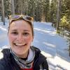 Anne on a snowy, wooded trail