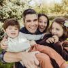 Tom with his wife and two children