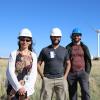 Researchers at the NREL Flatirons Campus, posing in front of the two-bladed SUMR-D in the background.