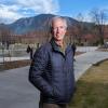 Scott King on campus near the Rustandy Building, with the Flatirons in the background