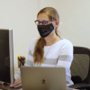 Lehman at work at a computer in her office
