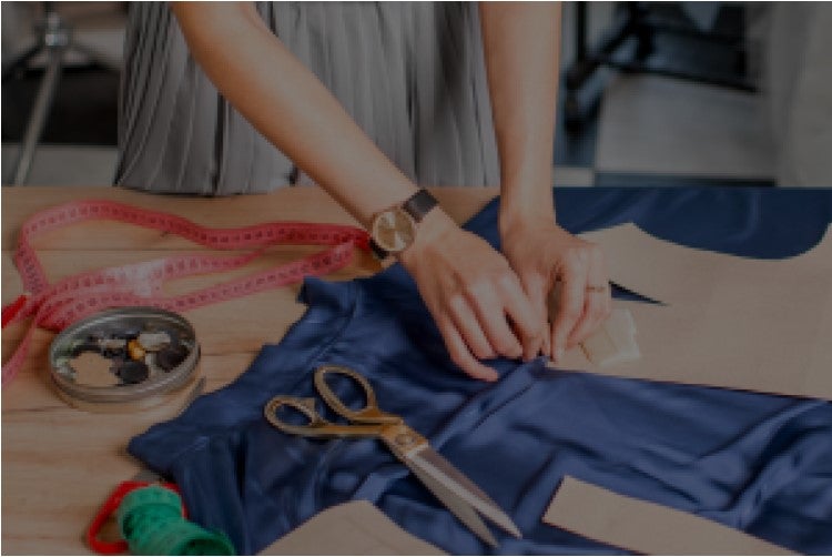 person sewing clothes