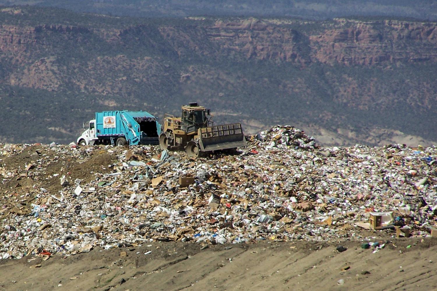 Landfill with tractors and dump truck