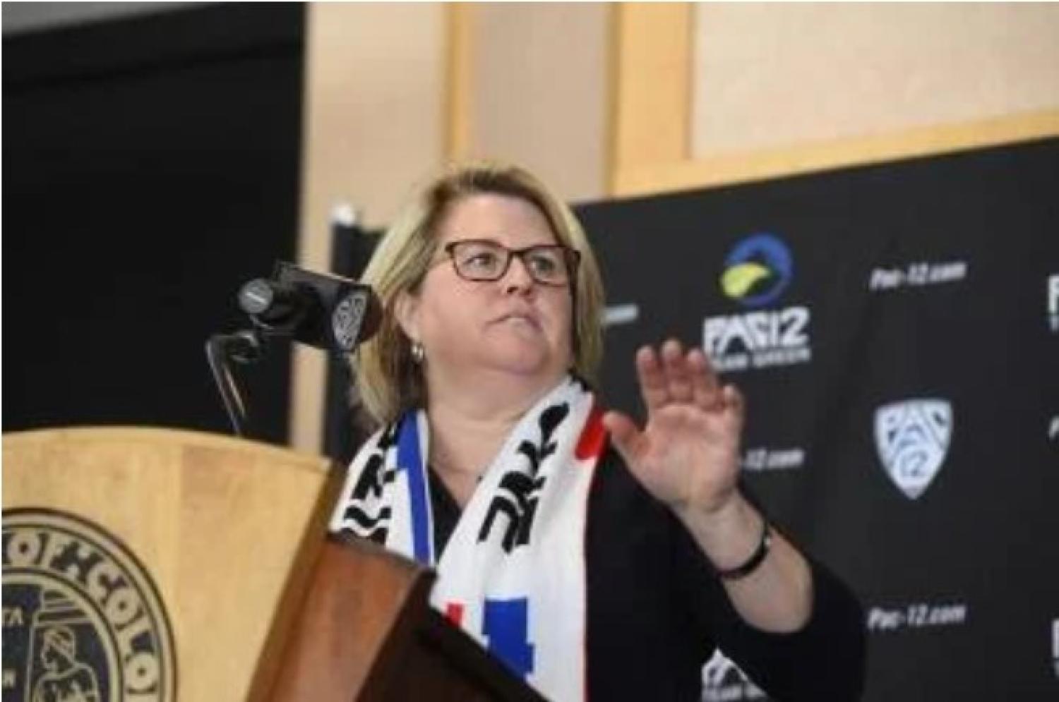 woman speaking at podium