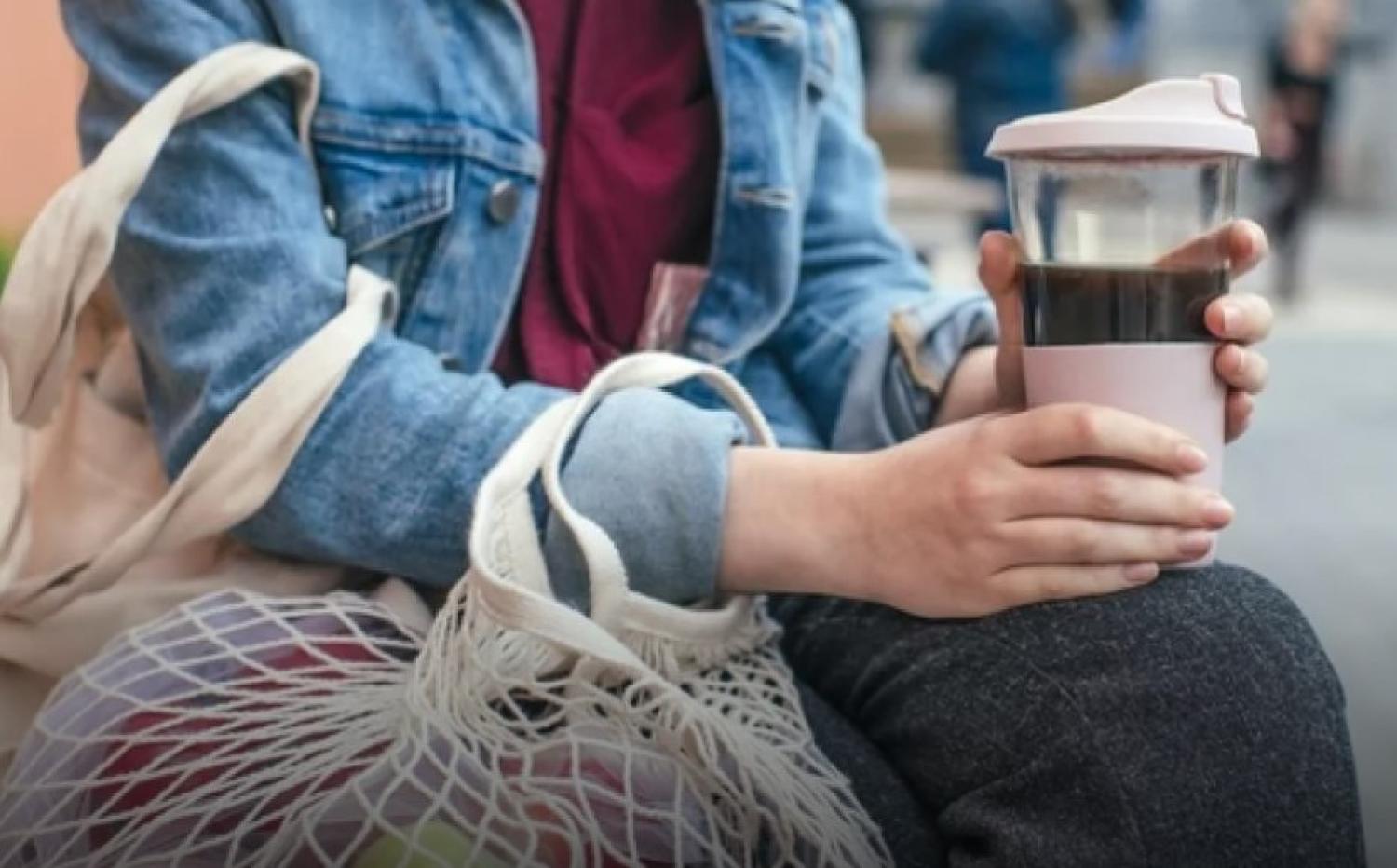 person holding cup of coffee