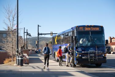 students boarding RTD bus