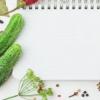 blank notebook and vegetables