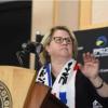 woman speaking at podium