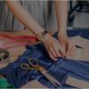 person sewing clothes