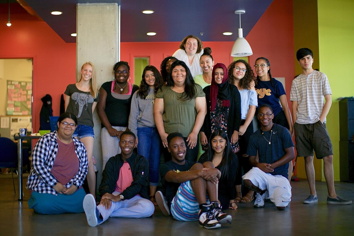 A diverse group of about 15 teenagers from Project Voyce