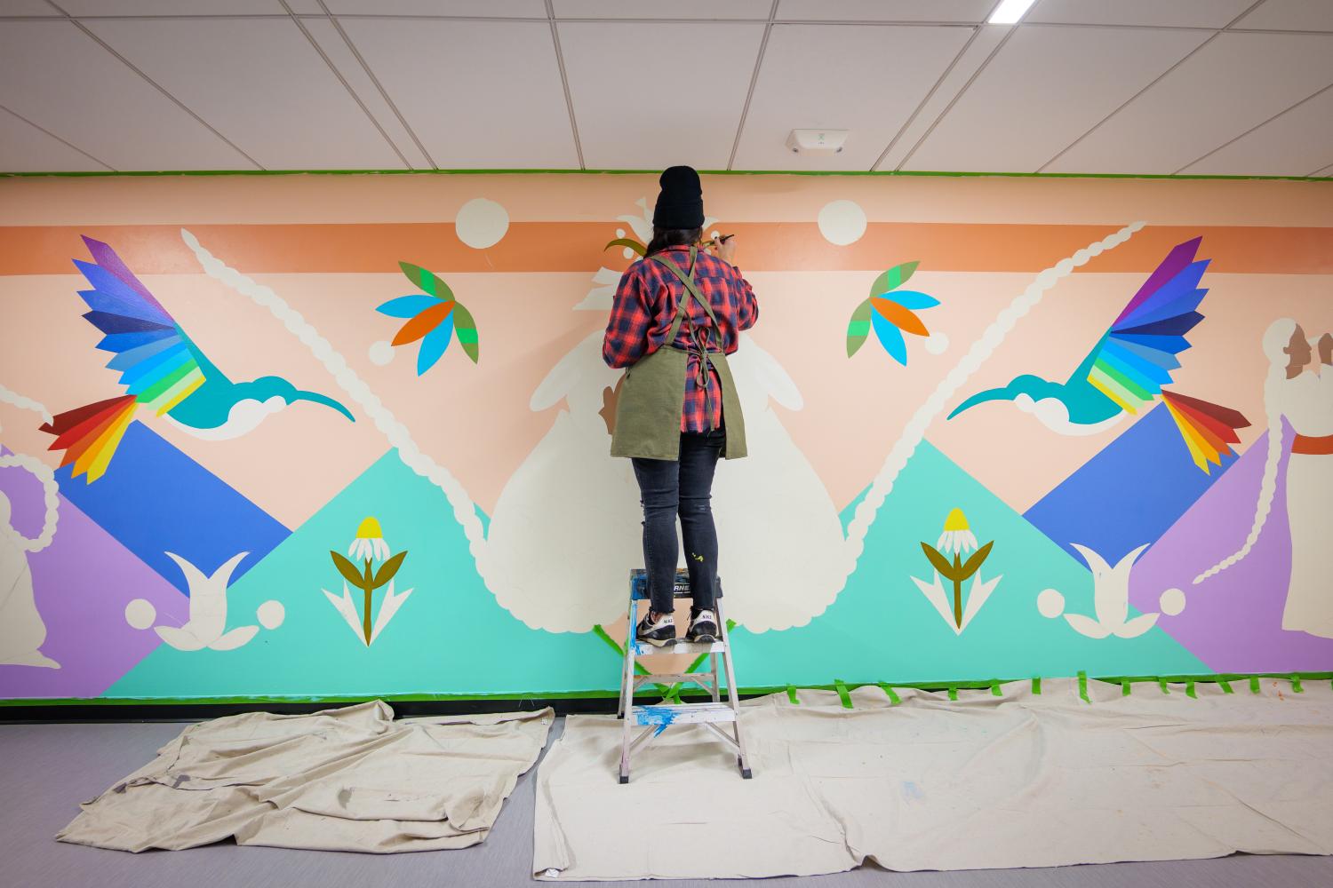 Danielle SeeWalker painting mural