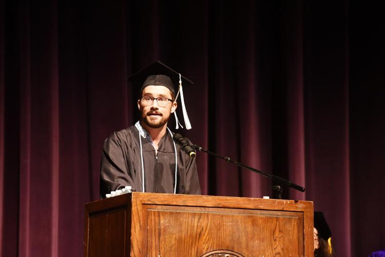 Tyler LeCroy speaking at graduation